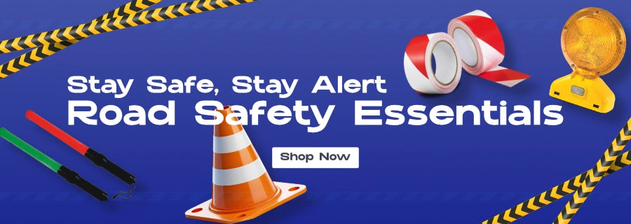 Road safety products including traffic cones, reflective tape, LED safety lights, and signal wands displayed on a blue background with the text 'Stay Safe, Stay Alert – Road Safety Essentials' and a 'Shop Now' button.