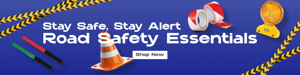 Road safety products including traffic cones, reflective tape, LED safety lights, and signal wands displayed on a blue background with the text 'Stay Safe, Stay Alert – Road Safety Essentials' and a 'Shop Now' button.