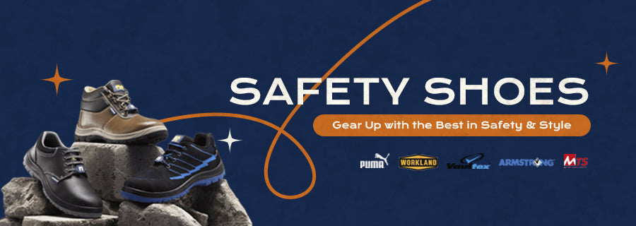 Various styles of safety shoes from brands like Puma, Workland, Vaultex, Armstrong, and MTS displayed on concrete blocks against a dark blue background with the text 'Safety Shoes – Gear Up with the Best in Safety & Style'.